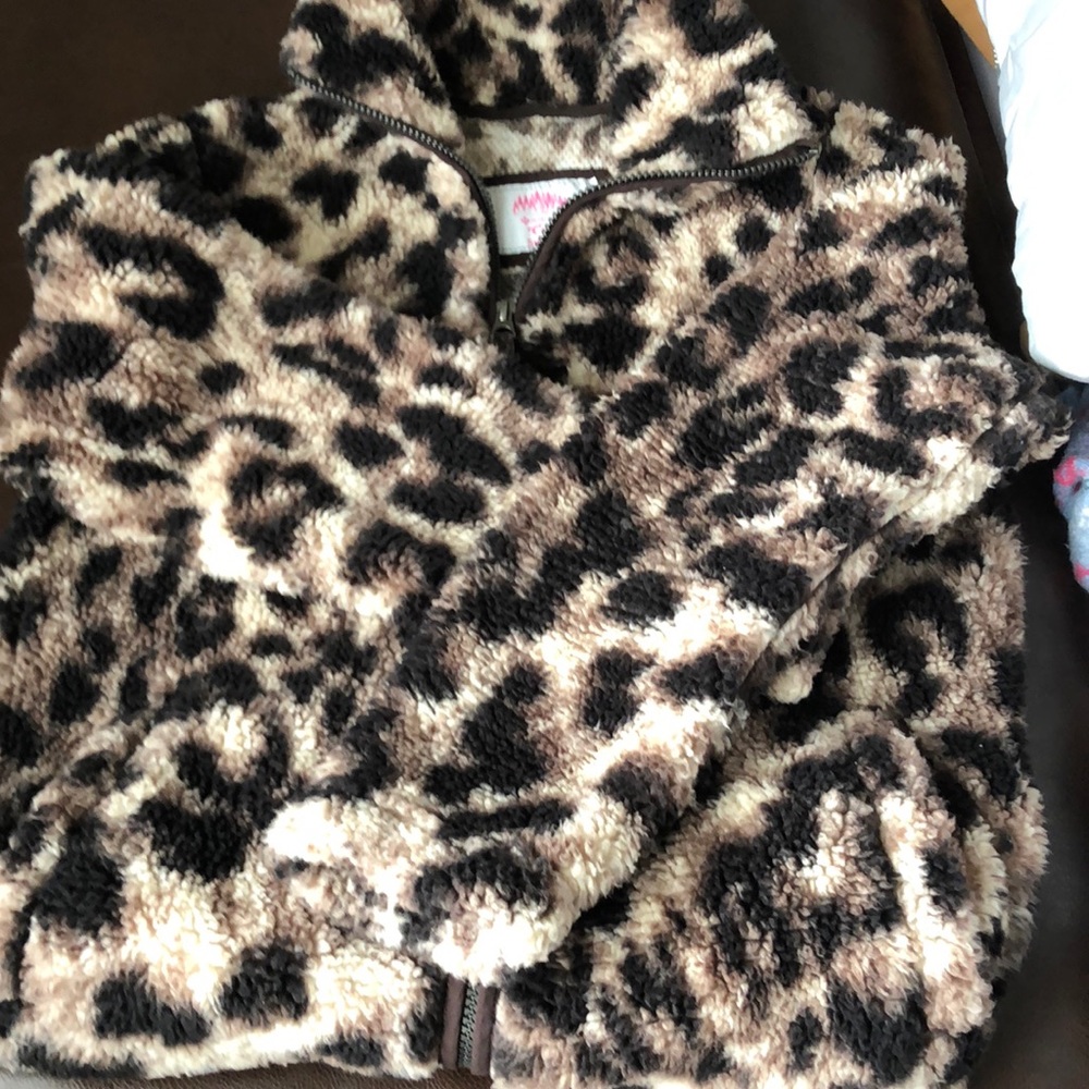 A leopard print Sherpa zip up